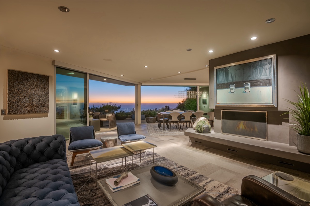 Living room with fireplace and open sliding doors
